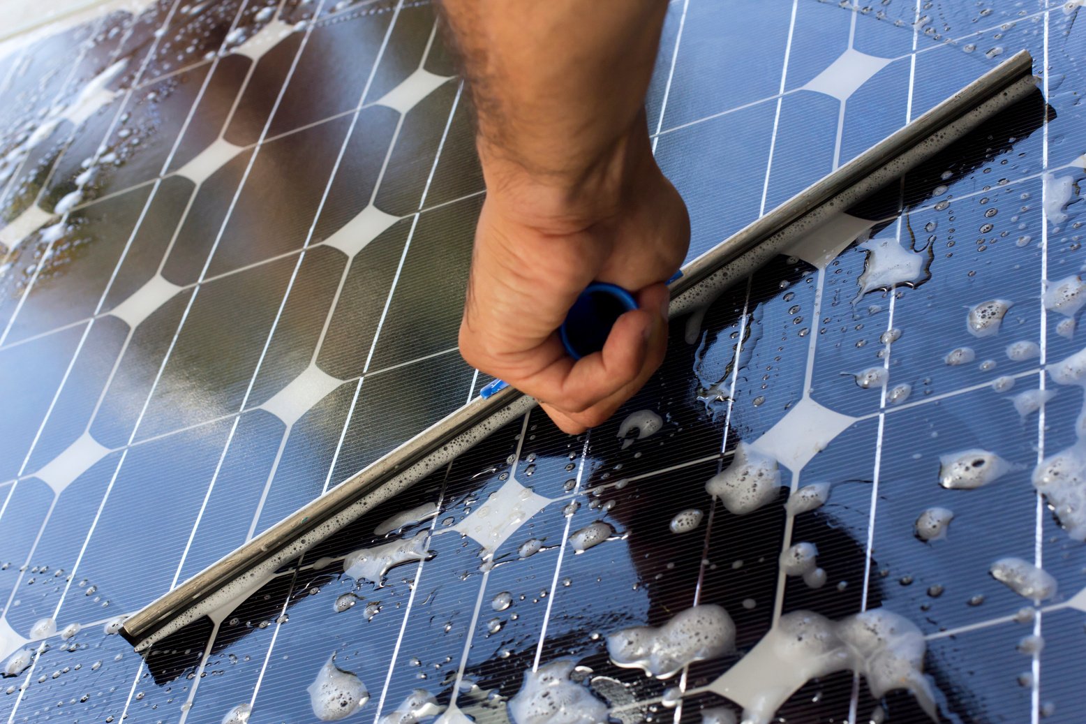 Cleaning solar panel with window cleaner